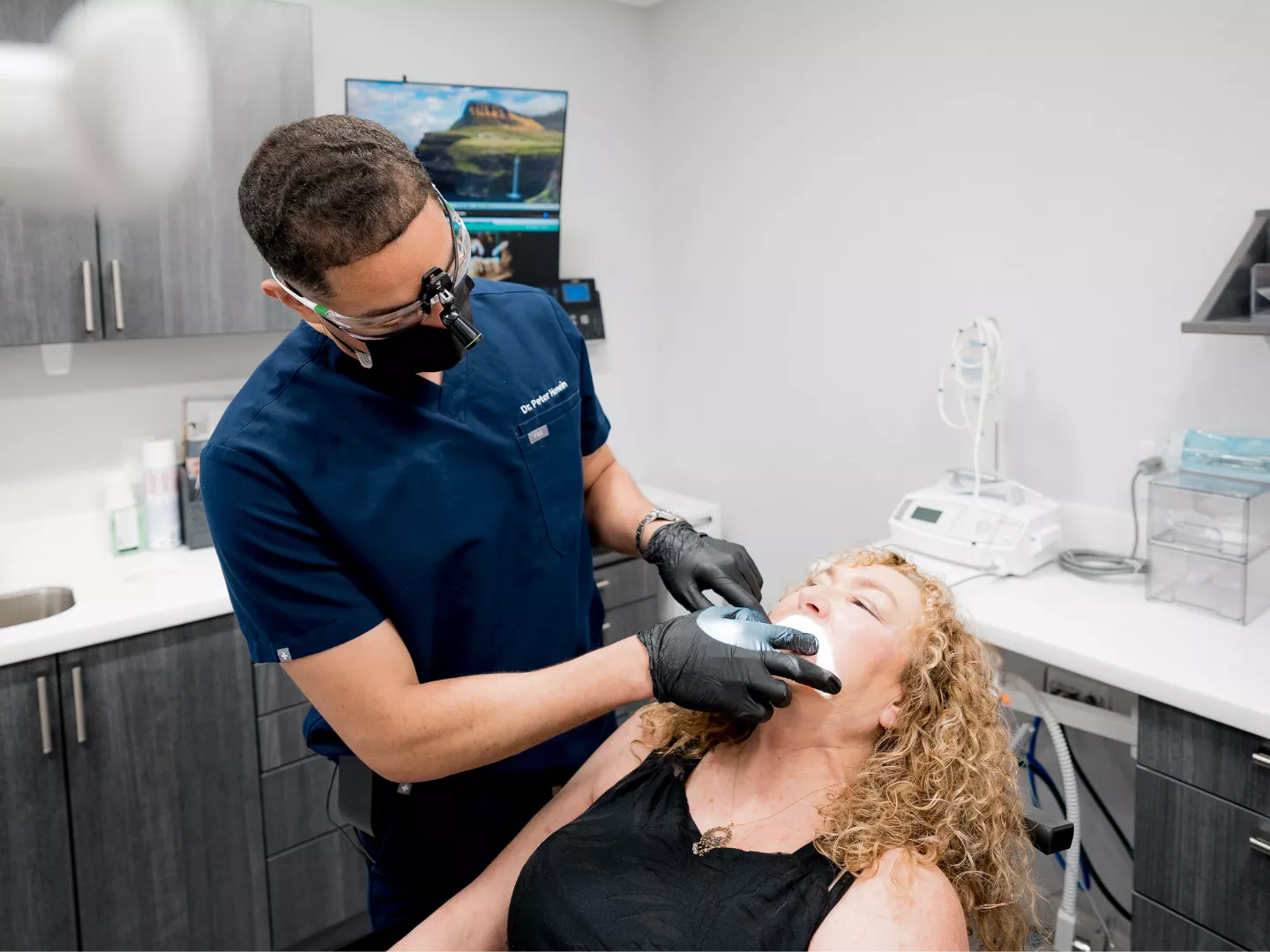 Dr. Henein examines a patient
